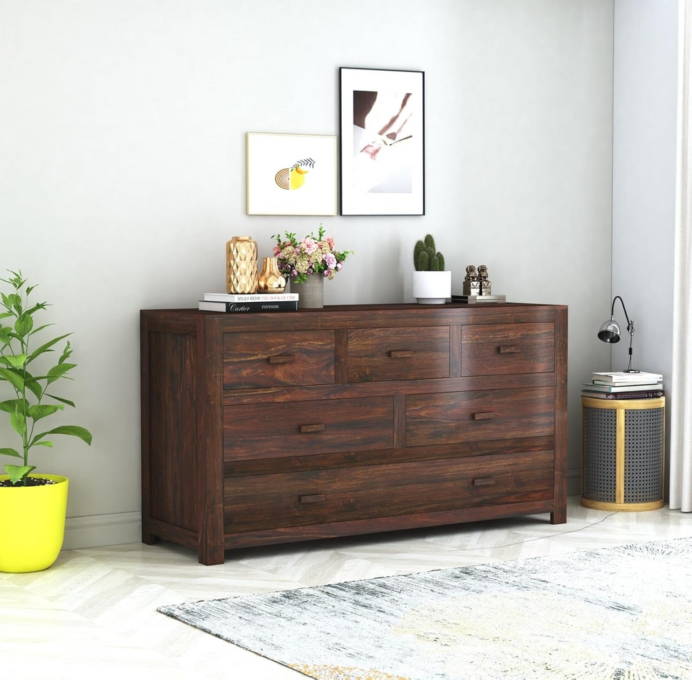 Sheesham wood chest of six drawers in walnut finish styled in a room